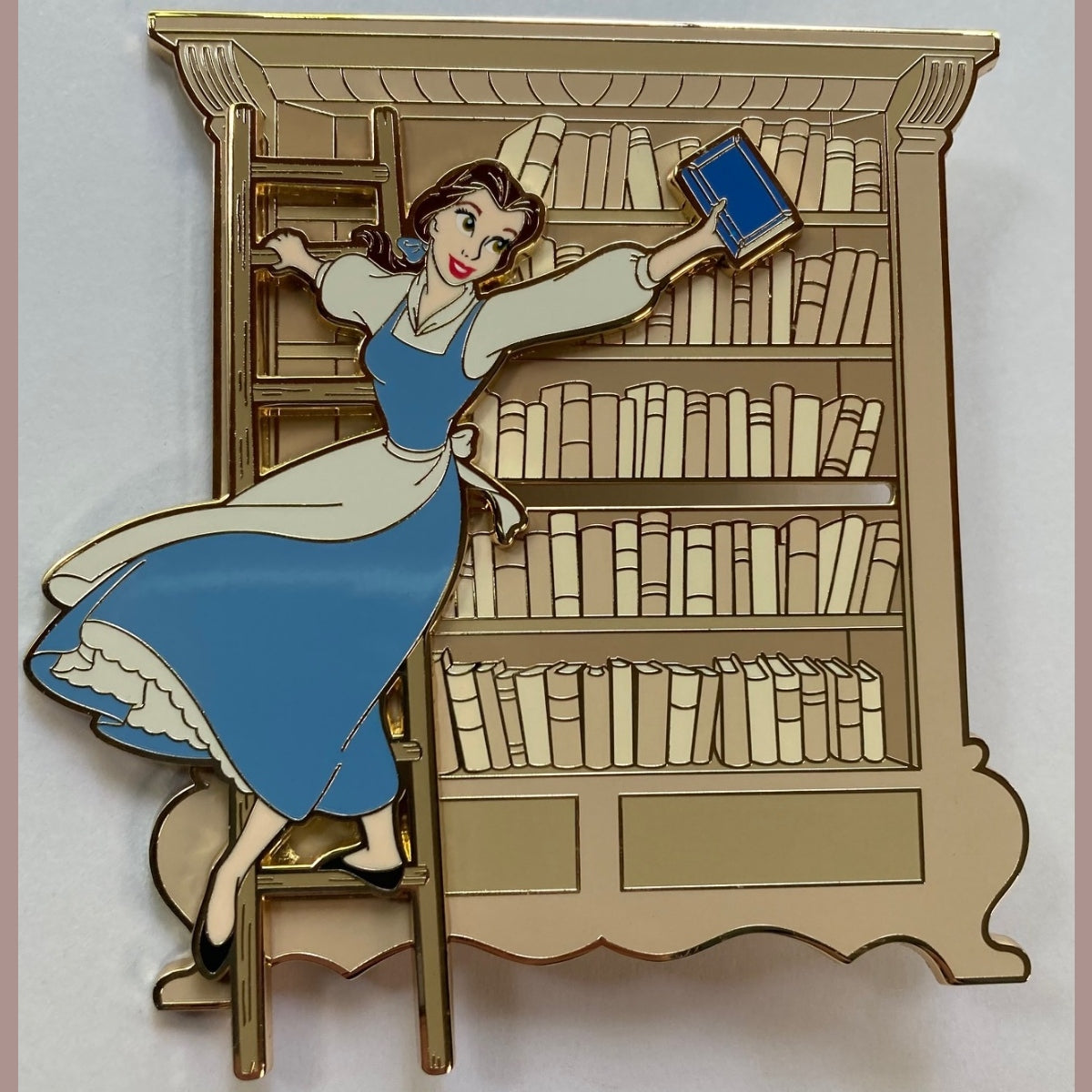 Belle slider pin shown moving across the library shelves