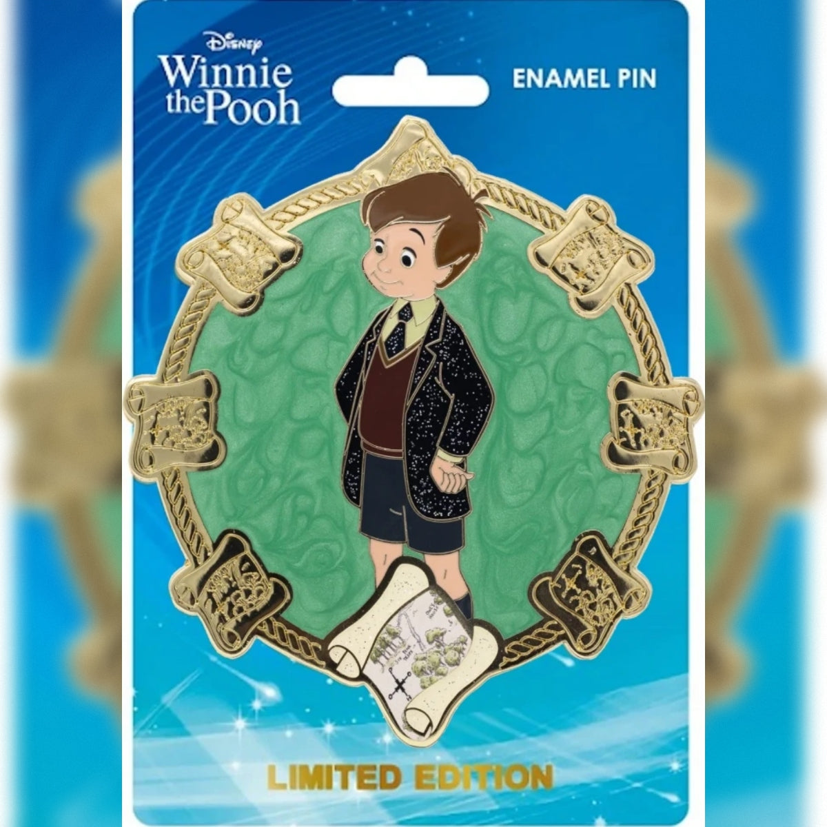Christopher Robin jumbo enamel pin featuring a map and gold border on its original blue backing card. Pin is part of PALM's Disney Classics Winnie the Pooh series from 2023.