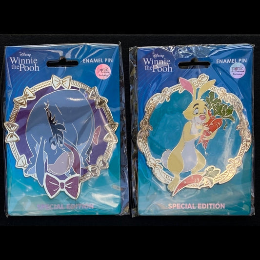 Eeyore and Rabbit PALM jumbo enamel pins from Disney’s Winnie the Pooh series on blue Special Edition backing cards in clear packaging.