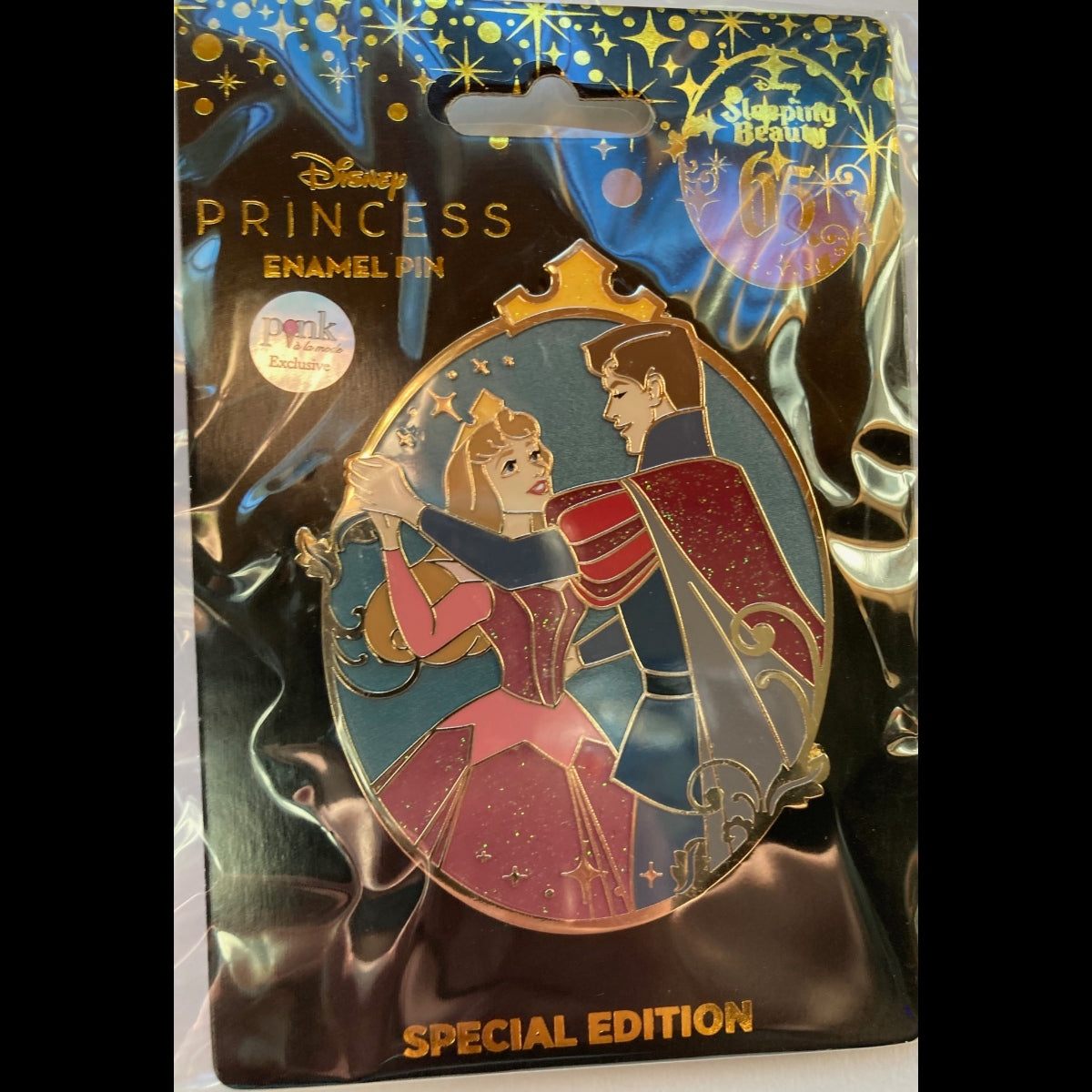 Disney Princess Enamel Pin Special Edition pin featuring Aurora and Prince Phillip, displayed on its original  backing card