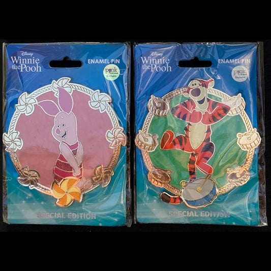 Piglet and Tigger PALM jumbo enamel pins from Disney’s Winnie the Pooh series on blue Special Edition backing cards in clear packaging.