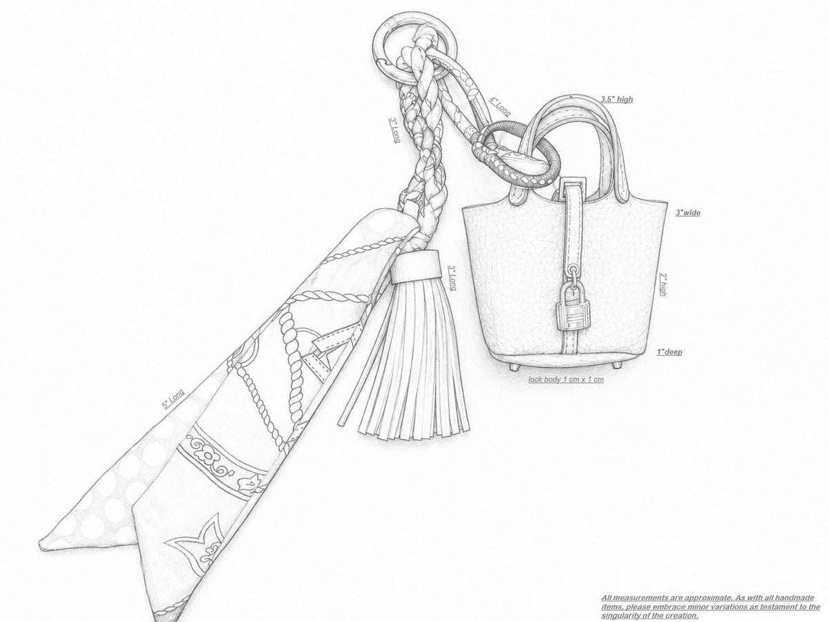 Black and white line art sketch of a handbag with a braided strap, tassel, and attached scarf, with some dimension labels.