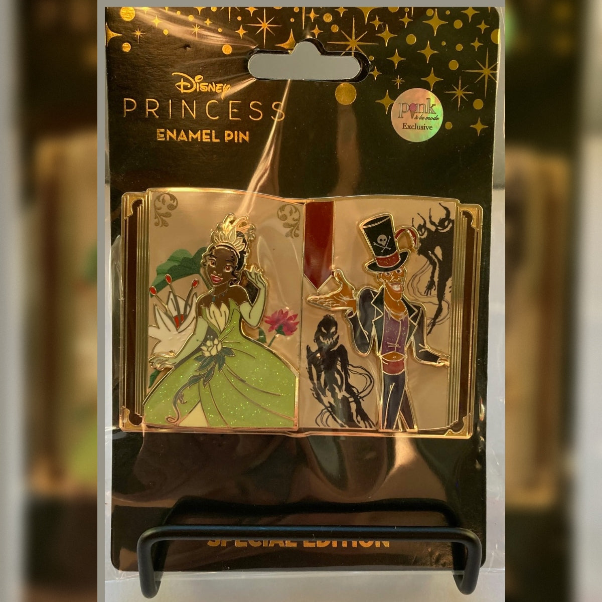 Disney Princess Enamel Pin Special Edition storybook pin in its original packaging, featuring Tiana and Dr. Facilier.