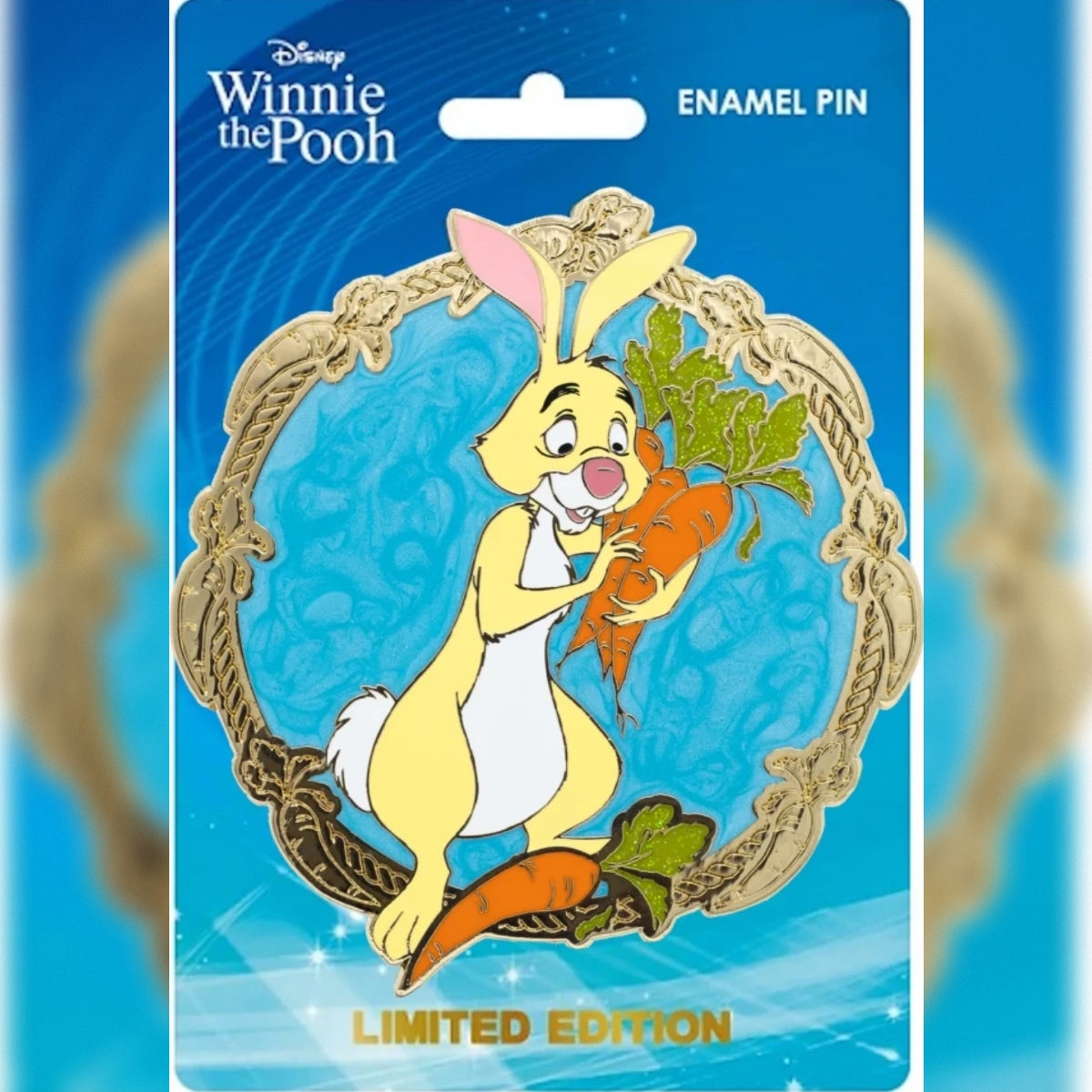 Rabbit PALM jumbo enamel pin holding carrots, with a turquoise background and gold border on a blue Disney Winnie the Pooh backing card.