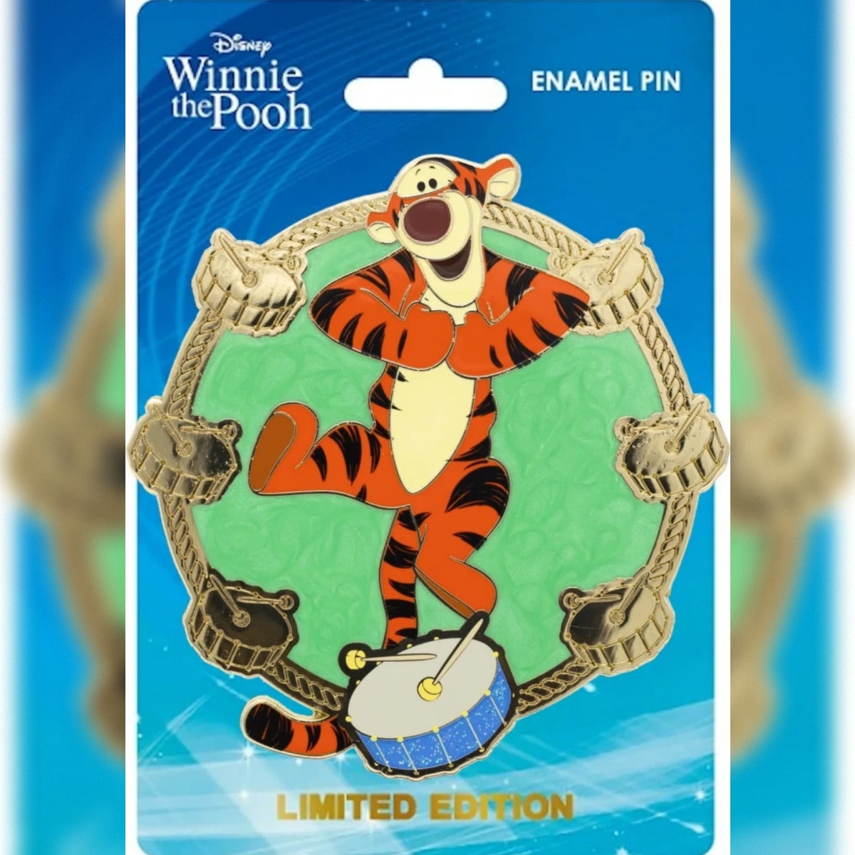 Tigger PALM jumbo enamel pin with a green background and gold drum border on a blue Disney Winnie the Pooh backing card.
