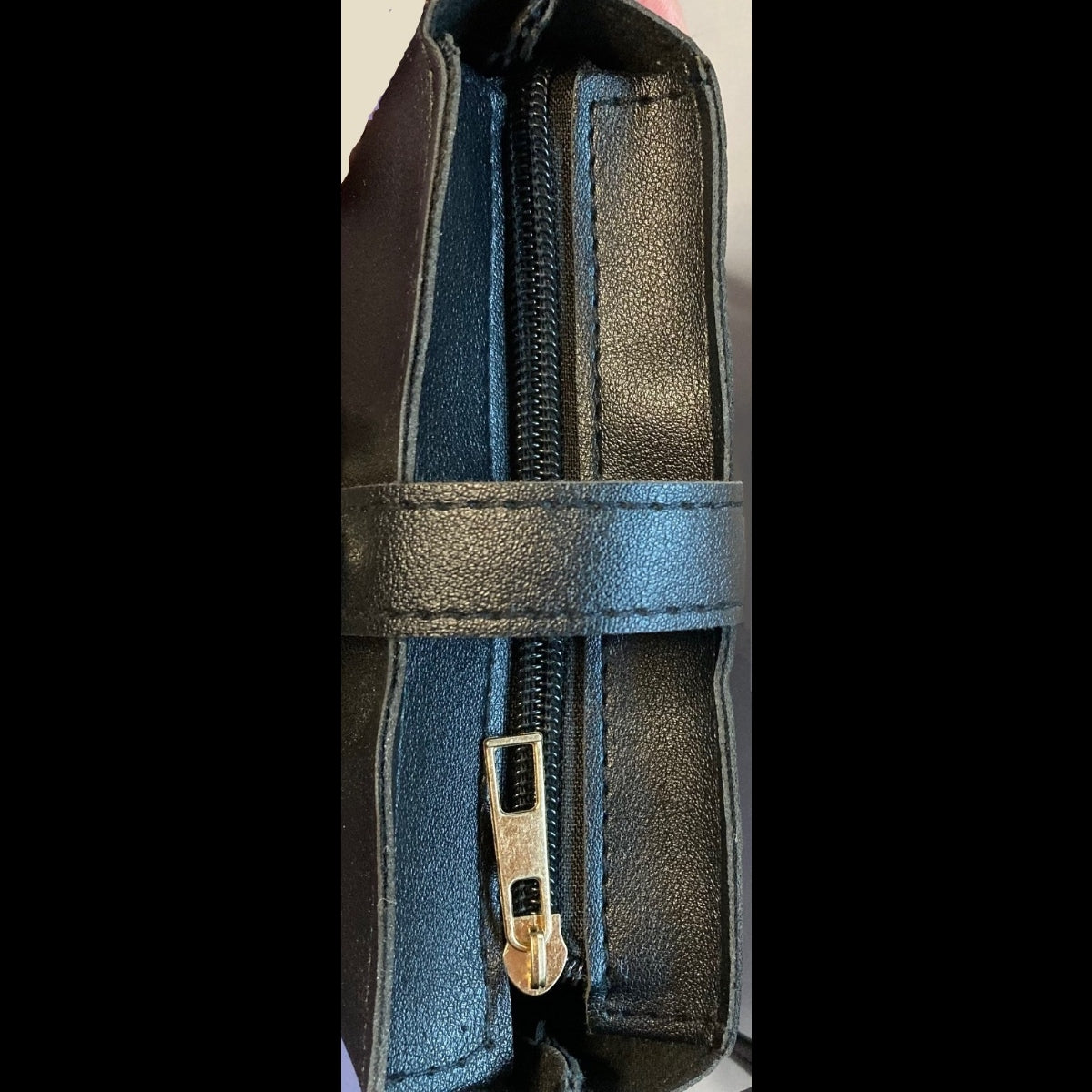 Top zipper detail of black rhinestone crossbody purse